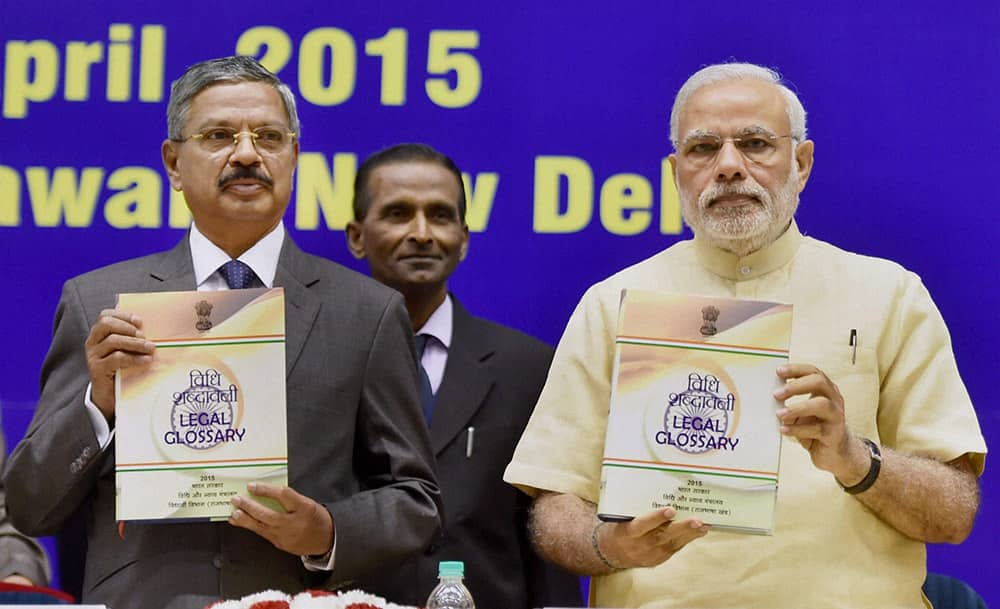 Prime Minister Narendra Modi with Chief Justice of India H L Dattu during the inauguration of the joint conference of the CMs and the CJs of High Courts at Vigyan Bhawan in New Delhi.