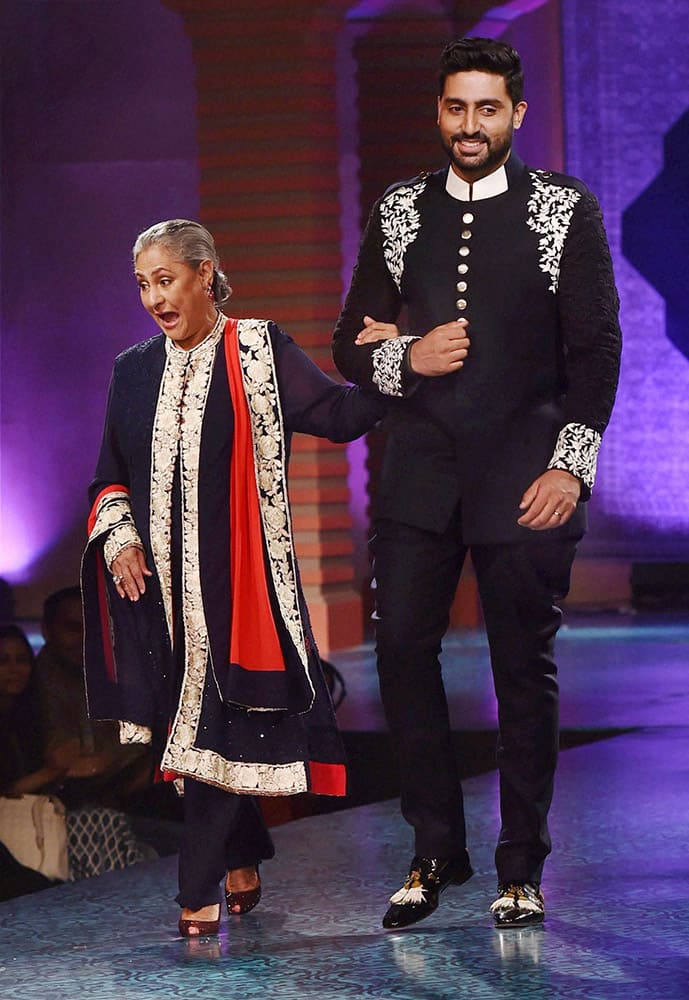 Bollywood actor Abhishek Bachchan alongwith mother Jaya Bachchan walk the ramp during fashion show 2015 for Shabana Azmis Mijwan Welfare Society in Mumbai.