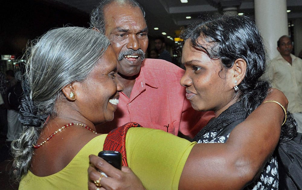A nurse evacuated from Yemen, is welcomed by her parents upon arrival in Kochi.