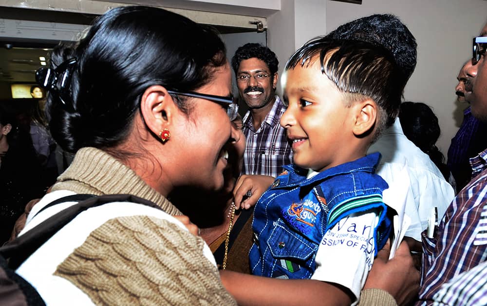 A nurse Tinu, one among the Indians evacuated from Yemen meets her son Febin upon her arrival in Kochi.