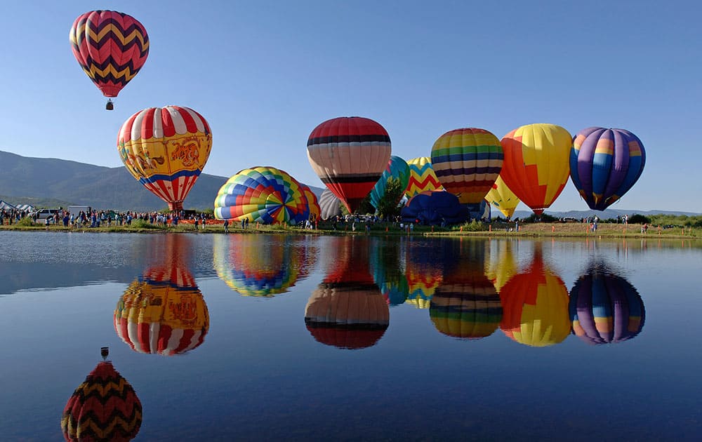 This photo provided by Steamboat Ski Resort shows hot air balloons that visitors can tour in above the town and mountains in Steamboat Springs, Colo.