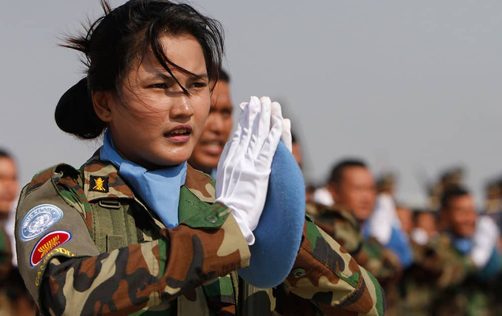 Cambodian soldiers swear during a send-off ceremony inside the Royal Cambodian Air Force in Phnom Penh, Cambodia.