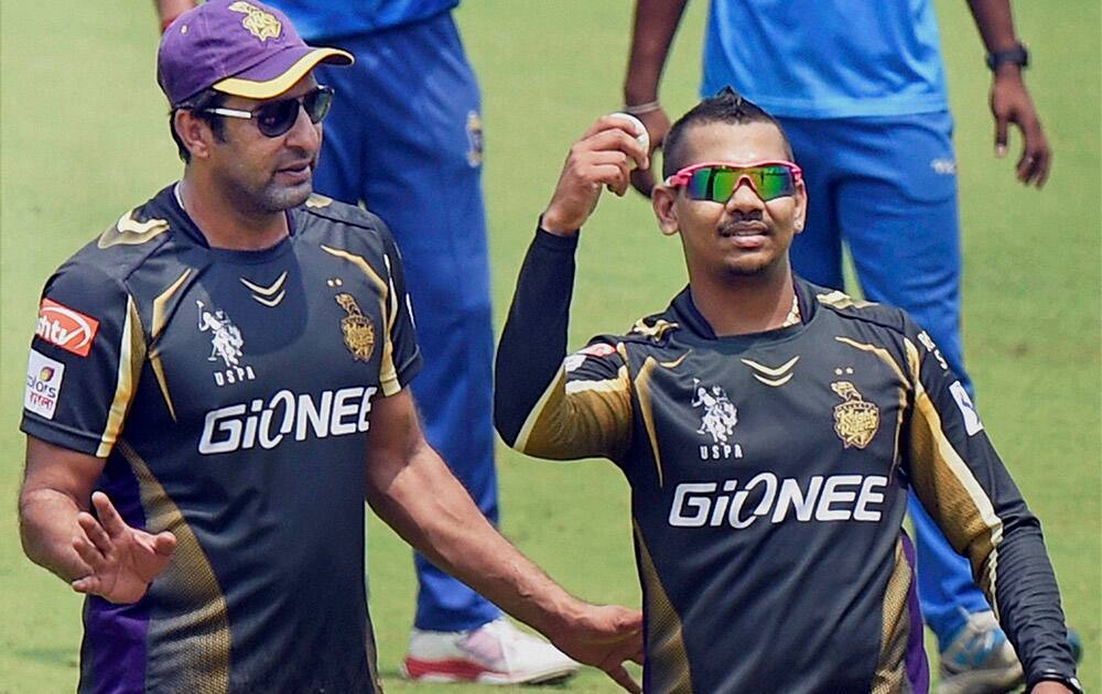 KKR player Sunil Narine and bowling coach Wasim Akram during a practice session at Eden Garden in Kolkata.