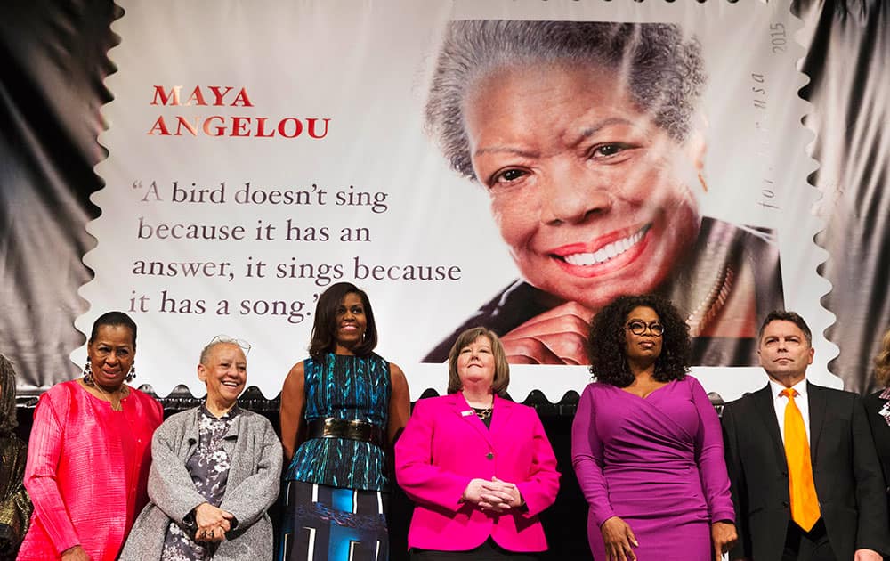 First lady Michelle Obama participates in the unveiling of the Maya Angelou Forever Stamp, at the Warner Theater in Washington. 