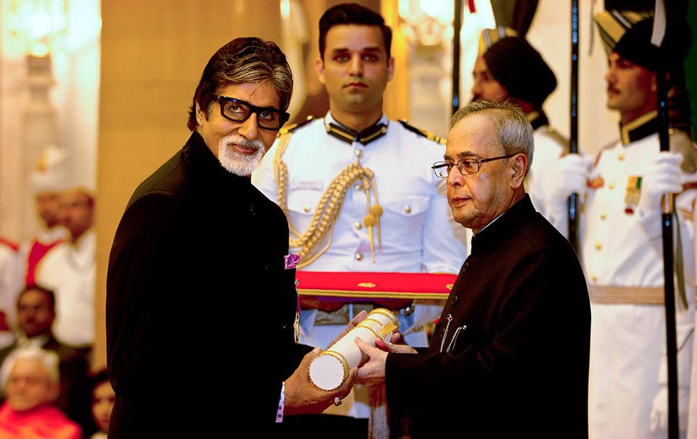 President Pranab Mukherjee confers the Padma Vibhushan to Bollywood superstar Amitabh Bachchan, during a civil investiture ceremony at the presidential palace in New Delhi.