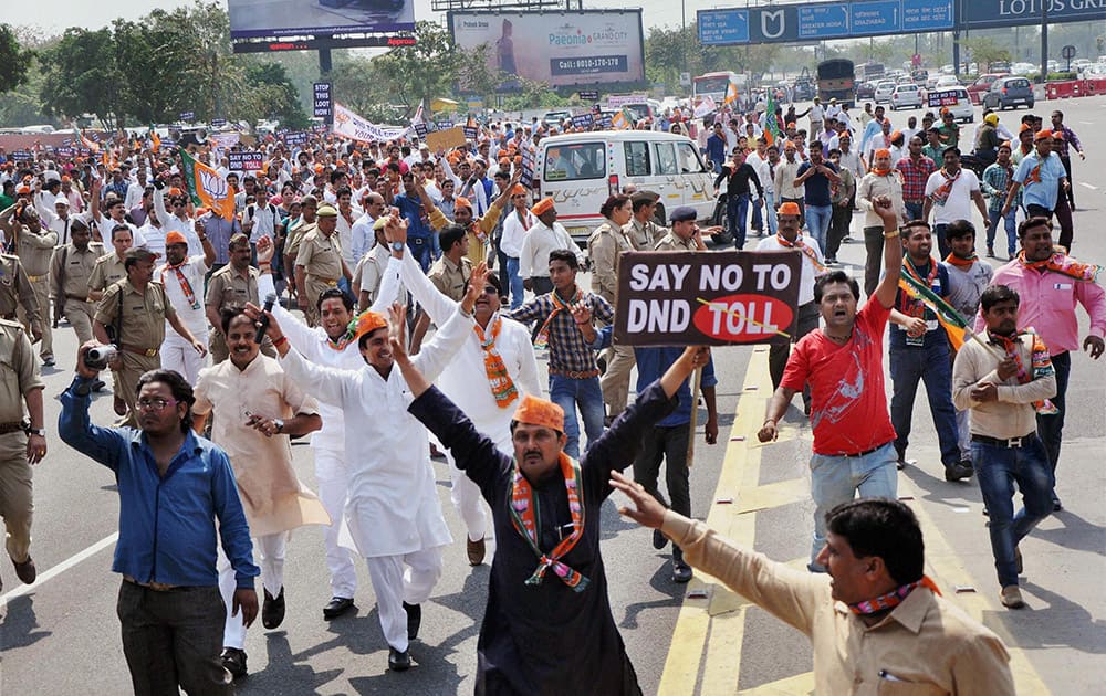 BJP workers protest demanding that Delhi-Noida Direct (DND) Flyway be made toll-free in Noida.