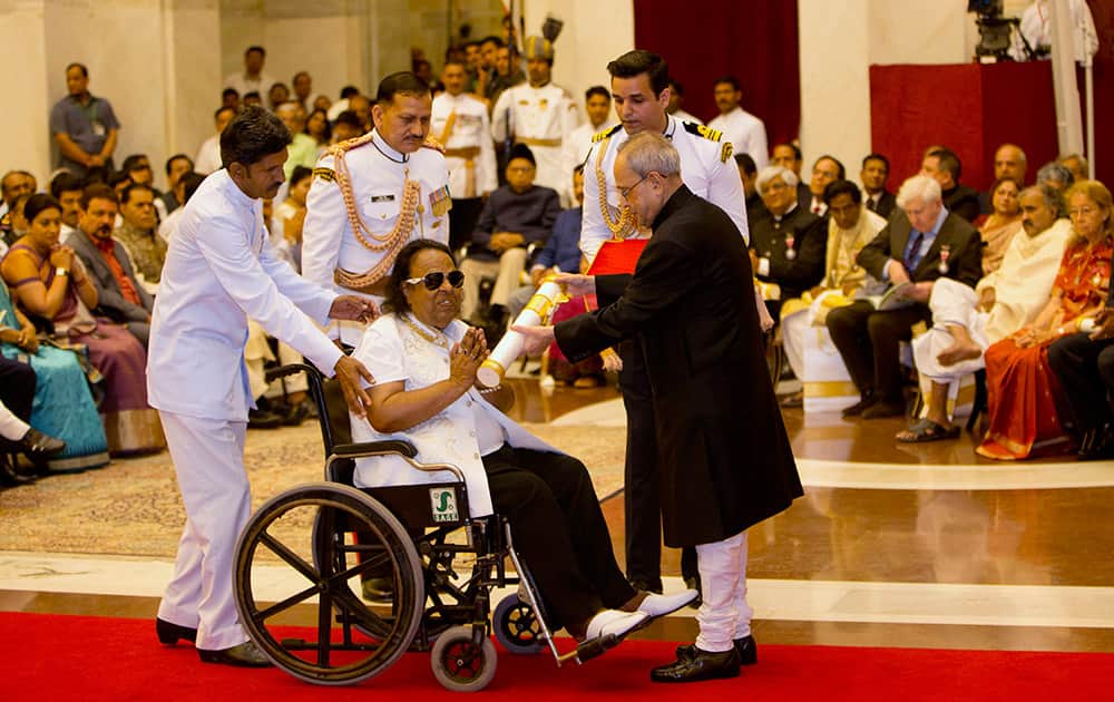 President Pranab Mukherjee confers the Padma Shri to musician Ravindra Jain during a civil investiture ceremony at the presidential palace in New Delhi.