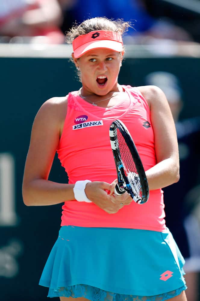 Jana Cepelova, from Slovakia, reacts to a shot against Sara Errani during a match at the Family Circle Cup tennis tournament in Charleston, S.C.