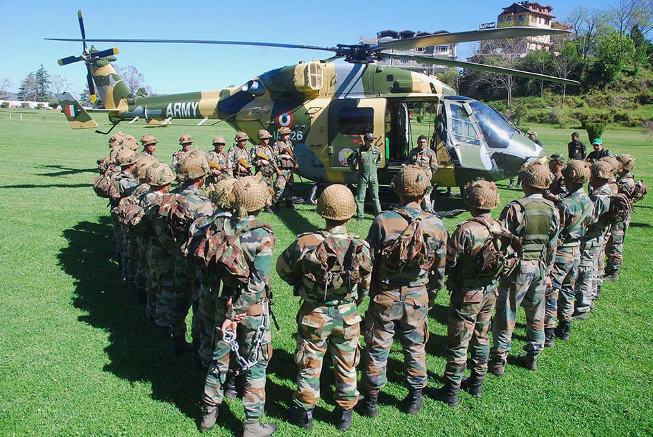 Army personnel during a mock drill Mountain Rescue for evacuation of people from the disaster affected areas in the mountains, at Annandale Ground in Shimla.