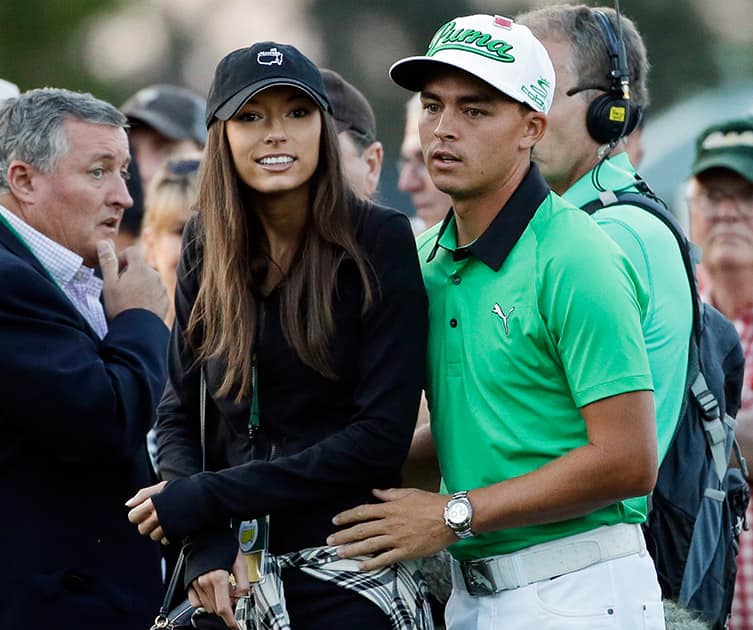 Rickie Fowler stands with his friend Alexis Randock before the honorary first tee during the first round of the Masters golf tournament.