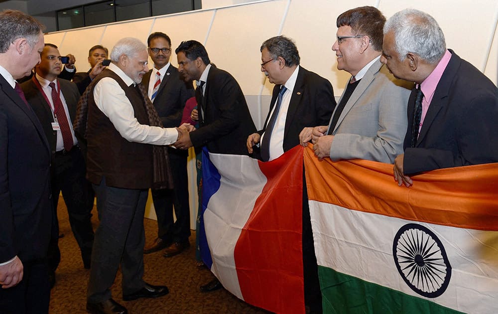 Prime Minister Narendra Modi meets people of Indian community upon his arrival at the Paris Orly International airport in France.