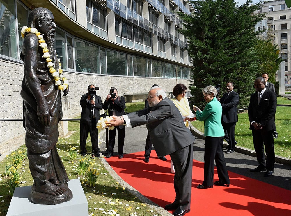 Prime Minister Narendra Modi with UNESCO Director-General Irina Bokova paying tributes at the statue of Sri Aurobindo at the UNESCO headquarters in Paris.