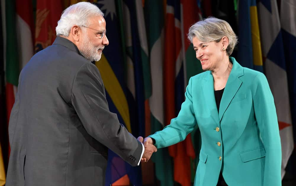 Prime Minister Narendra Modi is greeted by UNESCO Director-General Irina Bokova at the UNESCO headquarters in Paris.