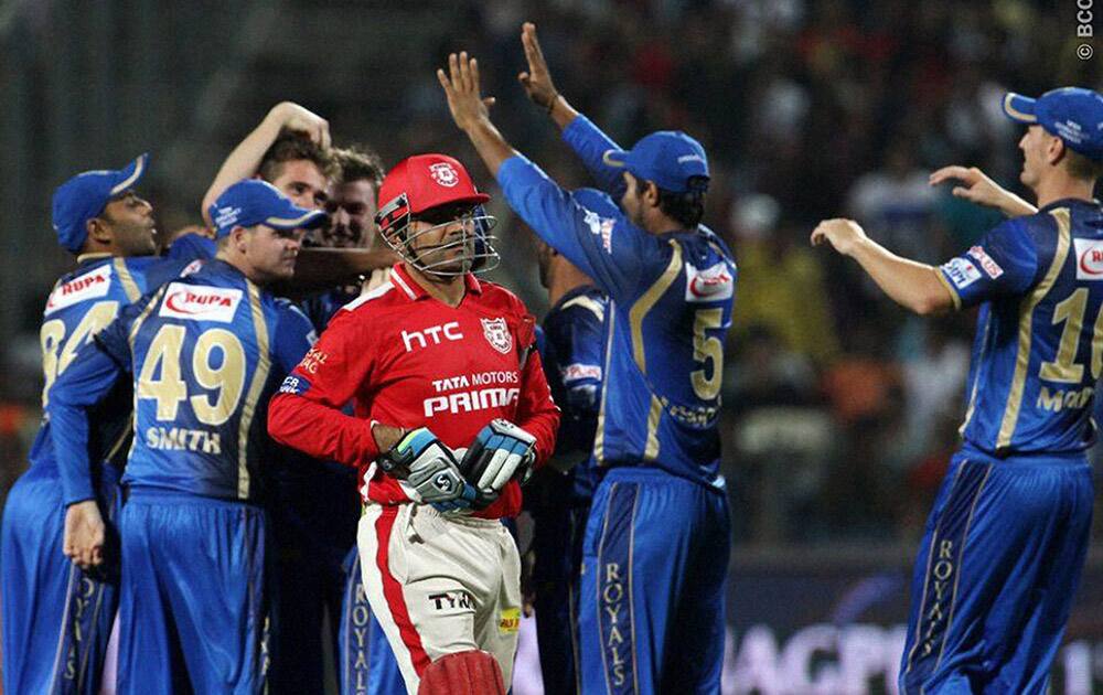 Kings XI Punjab player Virender Sehwag walks back to the pavilion during the IPL 2015 aganist Rajasthan Royals in Pune.