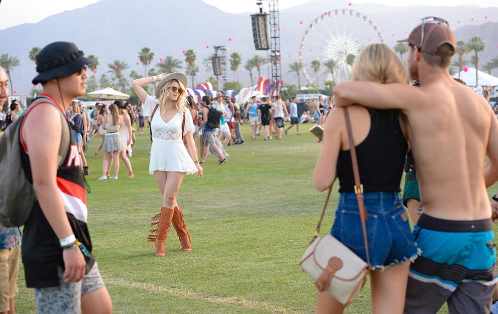 Festival goers enjoy the 2015 Coachella Music and Arts Festival, in Indio, Calif.