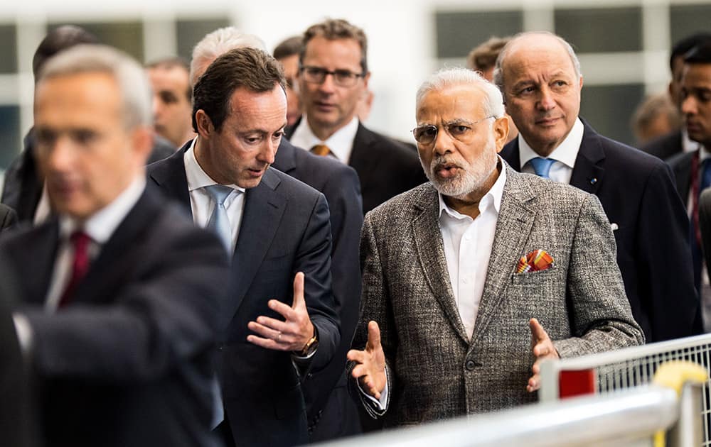 Prime minister Narenda Modi talks with Airbus CEO Fabrice Bregier as they visit the Airbus A380 Final Assembly Lane, in Blagnac Southern France.