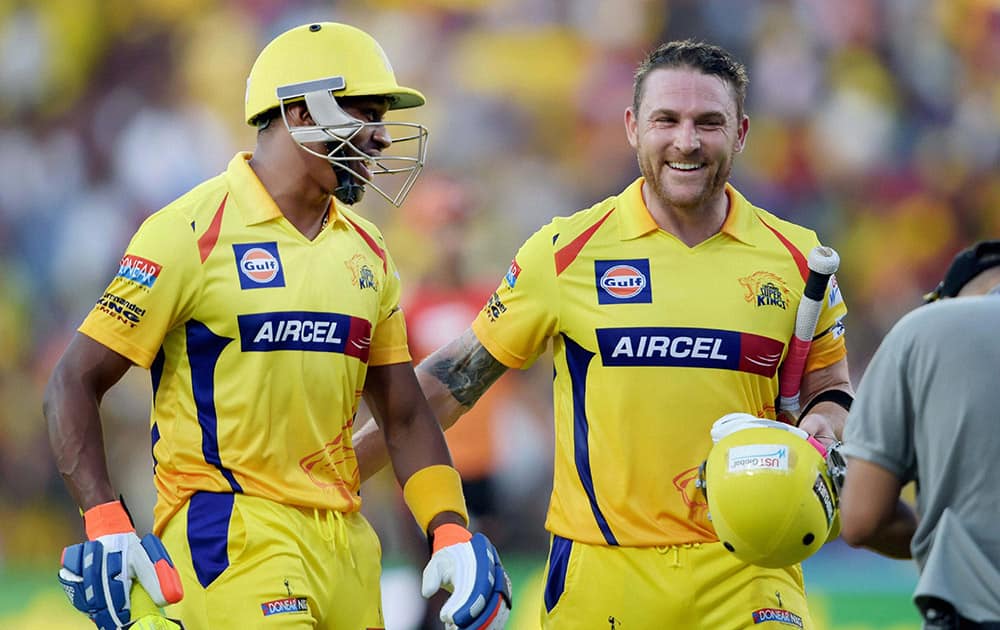 Chennai Super Kings’ opener Brendon McCullum along with teammate D Bravo after their innings during their IPL-2015 match against Sunrisers Hyderabad at MAC Stadium in Chennai.