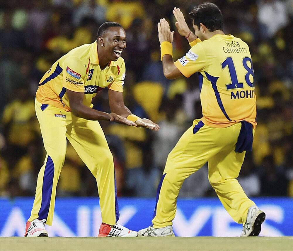 Chennai Super Kings’ players D Bravo and Mohit Sharma celebrate Sunrisers Hyderabads batsman Ravi Boparas wicket during their IPL-2015 match in Chennai.