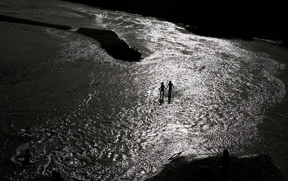 Kids play in the Virgin River during an event hosted by rancher Cliven Bundy.