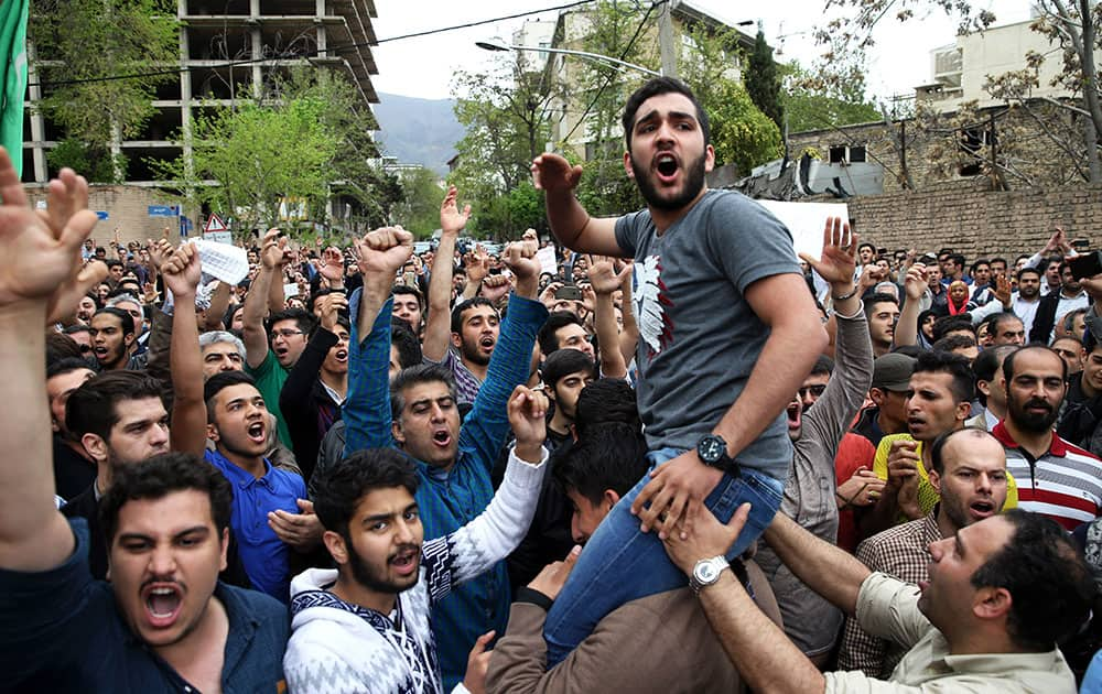 Iranian protesters chant slogans in front of the Saudi Embassy in Tehran, Iran.