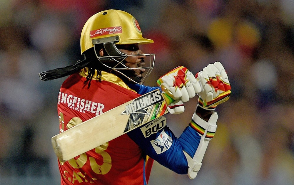 RCB player Chris Gayle plays a shot against Kolkata Knight Riders during an IPL-2015 match at Eden Garden in Kolkata.