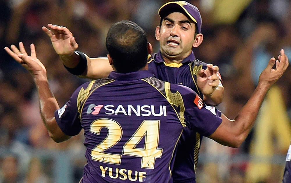 KKR Captain Gautam Gambhir with Yusuf Pathan celebrates after dismissing a RCB player Mandeep Singh during an IPL-2015 match at Eden Garden in Kolkata.