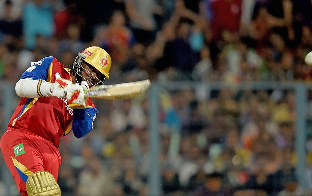 RCB player Chris Gayle plays a shot against Kolkata Knight Riders during an IPL-2015 match at Eden Garden in Kolkata.