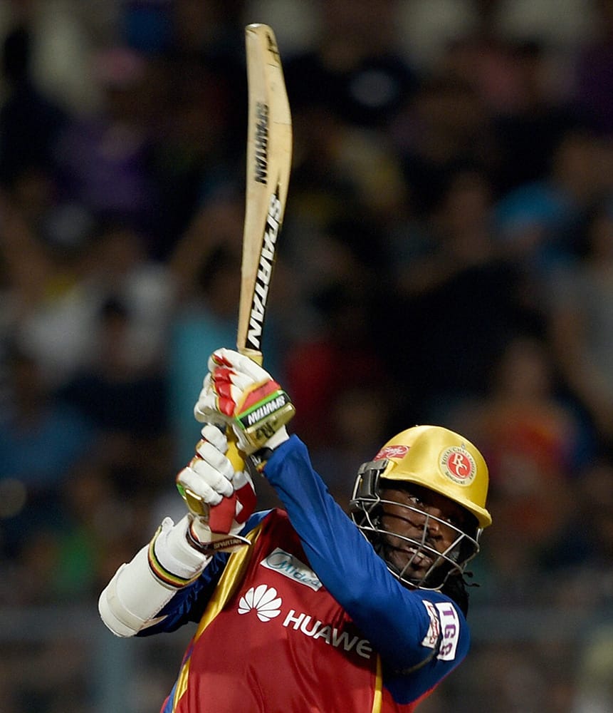 RCB player Chris Gayle plays a shot against Kolkata Knight Riders during an IPL-2015 match at Eden Garden in Kolkata.