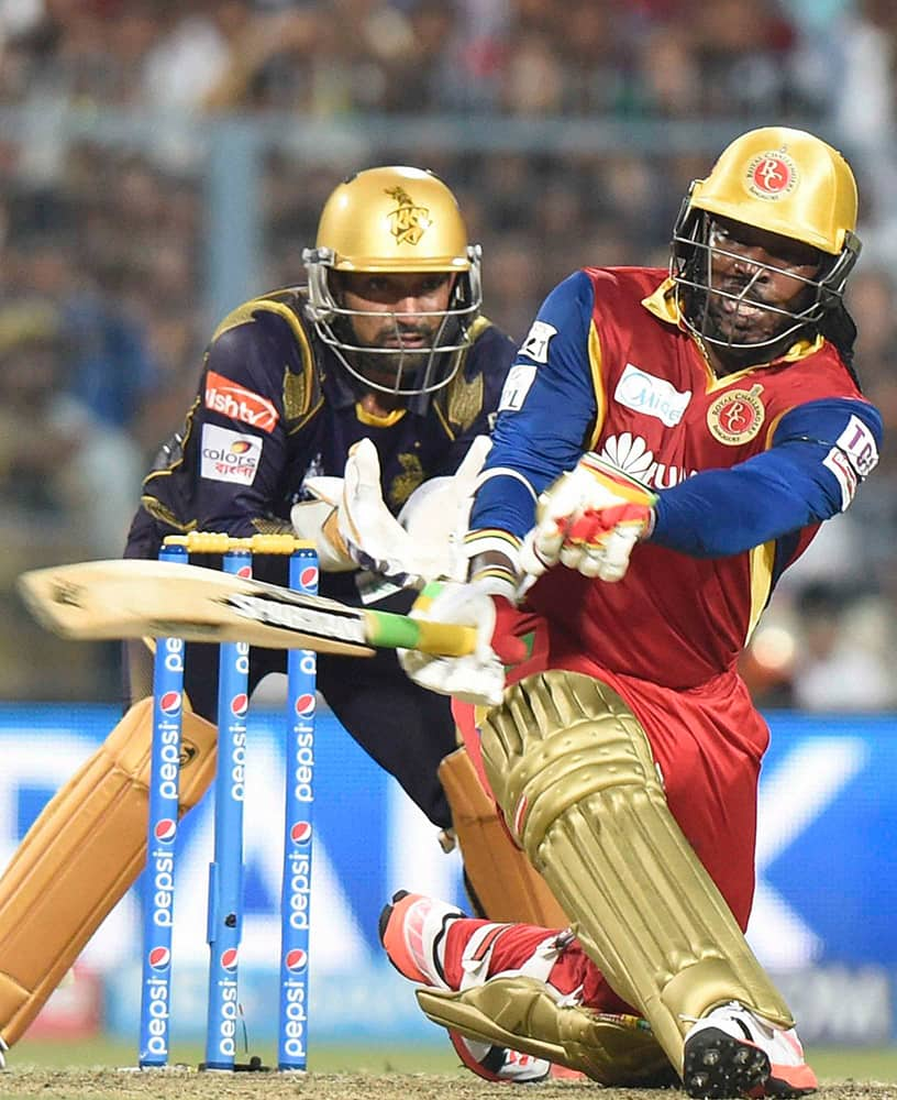 RCB player Chris Gayle plays a shot against Kolkata Knight Riders during an IPL-2015 match at Eden Garden in Kolkata.