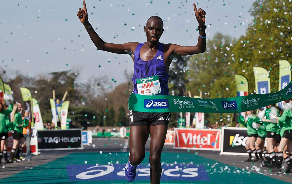 Mark Korir of Kenya, crosses the finish line to win the 39th Paris Marathon men's race.