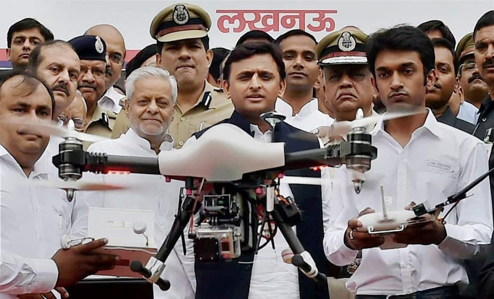 Uttar Pradesh Chief Minister Akhilesh Yadav with Senior Superintendent of Police (SSP) Yashasvi Yadav(left) launching drone camera under aerial surveillance project in Lucknow.