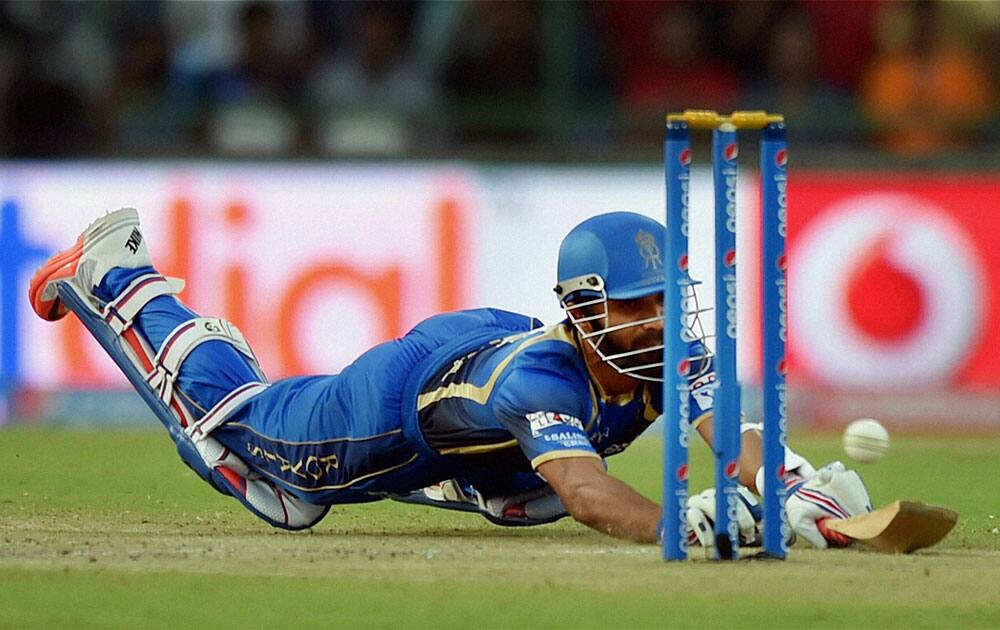 Rajasthan Royals batsman Ajinkya Rehane dives during an IPL match against Delhi Daredevils in New Delhi.