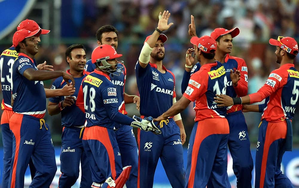 Delhi Daredevils bowler Amit Mishra celebrates with team mates after taking wicket of Rajasthan Royals batsmans Steve Smith during an IPL match in New Delhi.