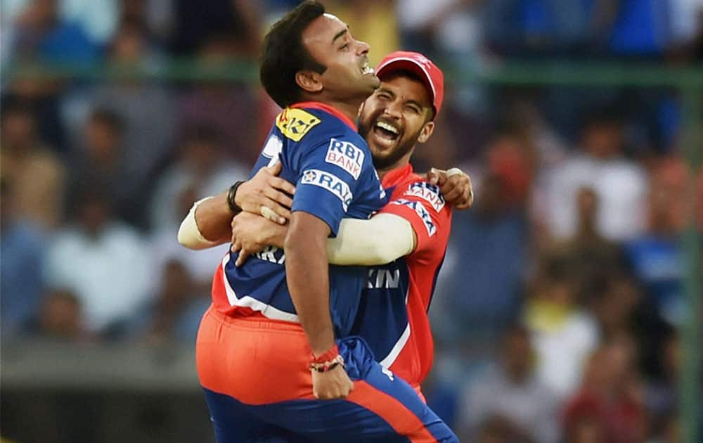 Delhi Daredevils bowler Amit Mishra celebrates with captain J P Duminy after taking wicket of Rajasthan Royals batsmans Steve Smith during an IPL match in New Delhi.