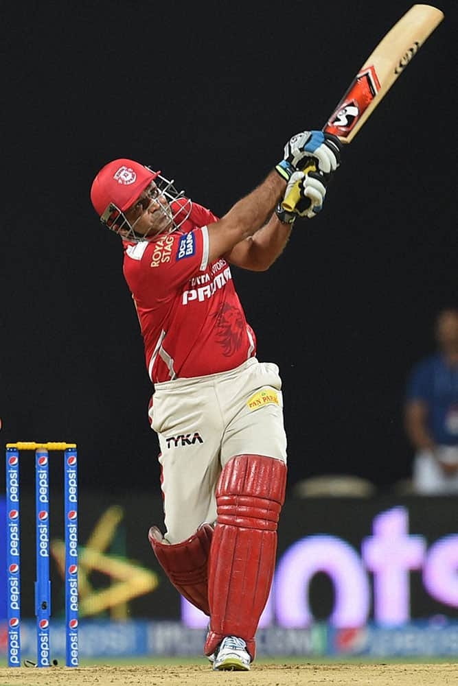 Kings XI Punjab batsman V Sehwag plays a shot against Mumbai Indians during the IPL T20 match in Mumbai.