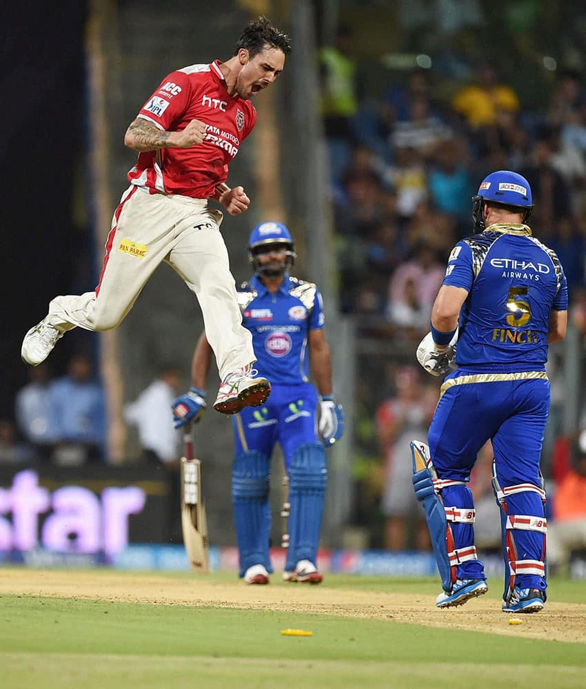 Kings XI Punjab bowler Mitchell Johnson celebrates a wicket of Mumbai Indians batsman Aaron Finch during a IPL T20 match played in Mumbai.