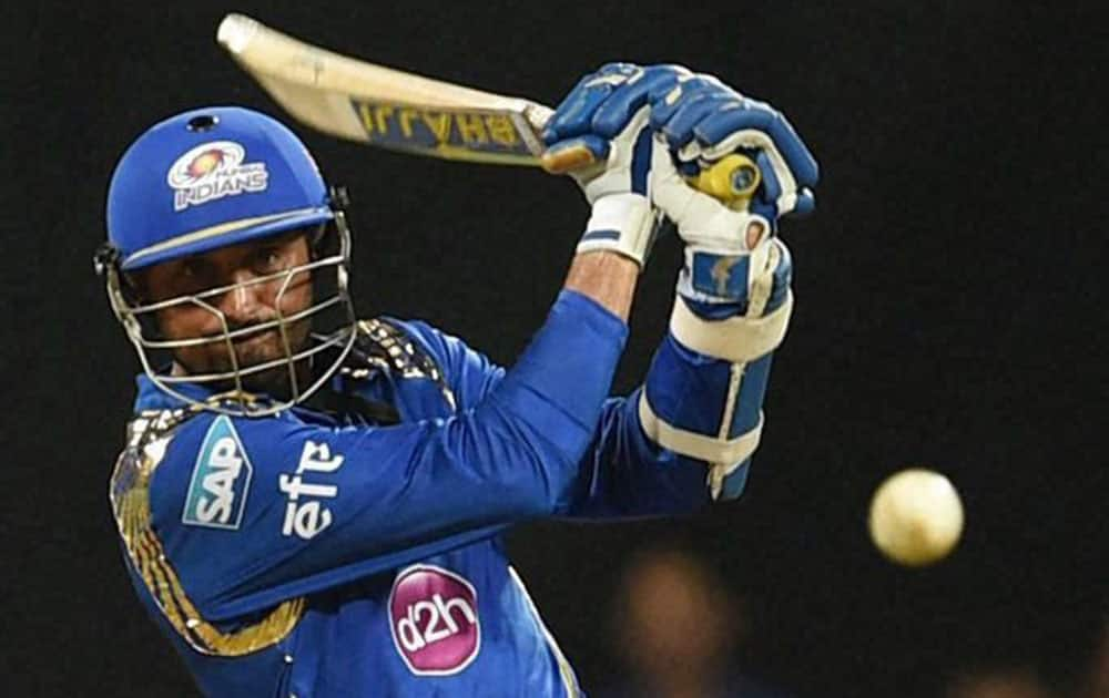 Mumbai Indians batsman Harbhajan Singh plays a shot against Kings XI Punjab during a IPL T20 match in Mumbai.