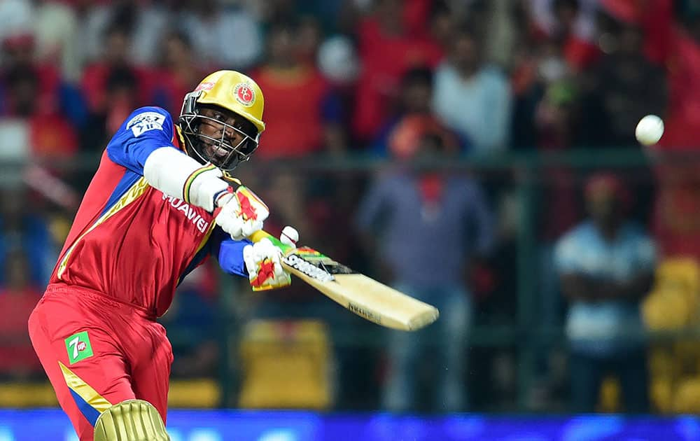 Royal Challengers Chris Gayle plays a shot during IPL 8 match against Sunrisers Hyderabad at Chinnaswamy Stadium in Bengaluru.
