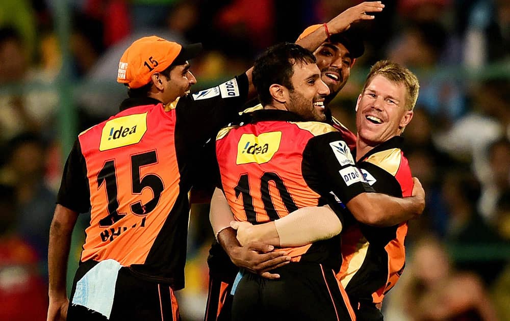 Sunrisers Hyderabad players celebrate wicket of Royal Challengers Bangalore Mandeep Singh during IPL 8 match at Chinnaswamy Stadium in Bengaluru.