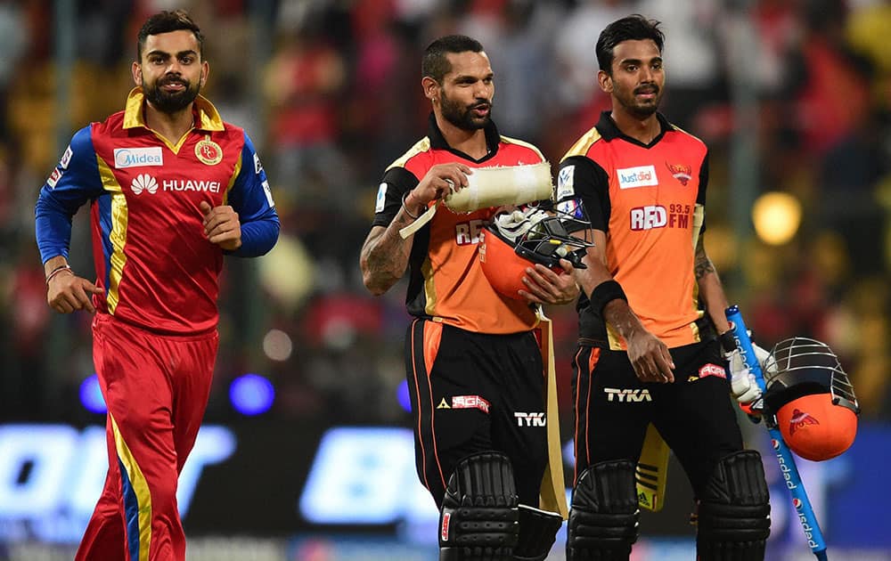 Sunrisers Hyderabad players Shikhar Dhawan and KL Rahul returns after winning against Royal Challengers Bangalore during IPL 8 match at Chinnaswamy Stadium in Bengaluru.