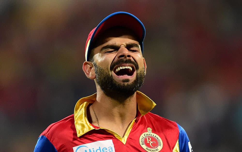  Royal Challengers Bangalore Skipper Virat Kohli reacts during IPL 8 match against Sunrisers Hyderabad at Chinnaswamy Stadium in Bengaluru.