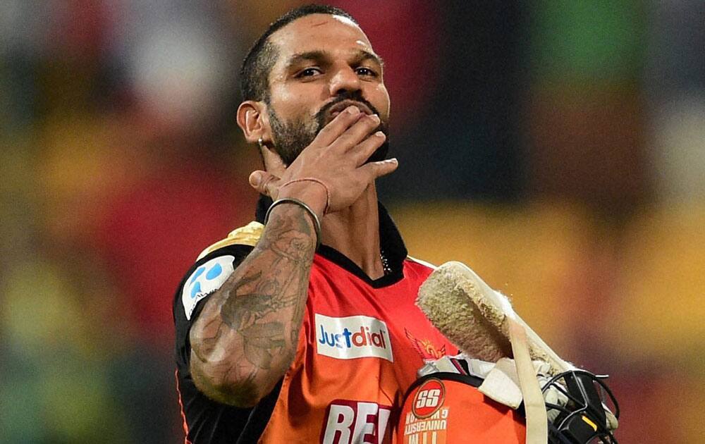 Sunrisers Hyderabad player Shikhar Dhawan returns after winning against Royal Challengers Bangalore during IPL 8 match at Chinnaswamy Stadium in Bengaluru.