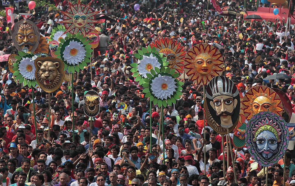 Bangladeshi people participate in a rally to celebrate the first day of the Bangla New Year in Dhaka, Bangladesh.