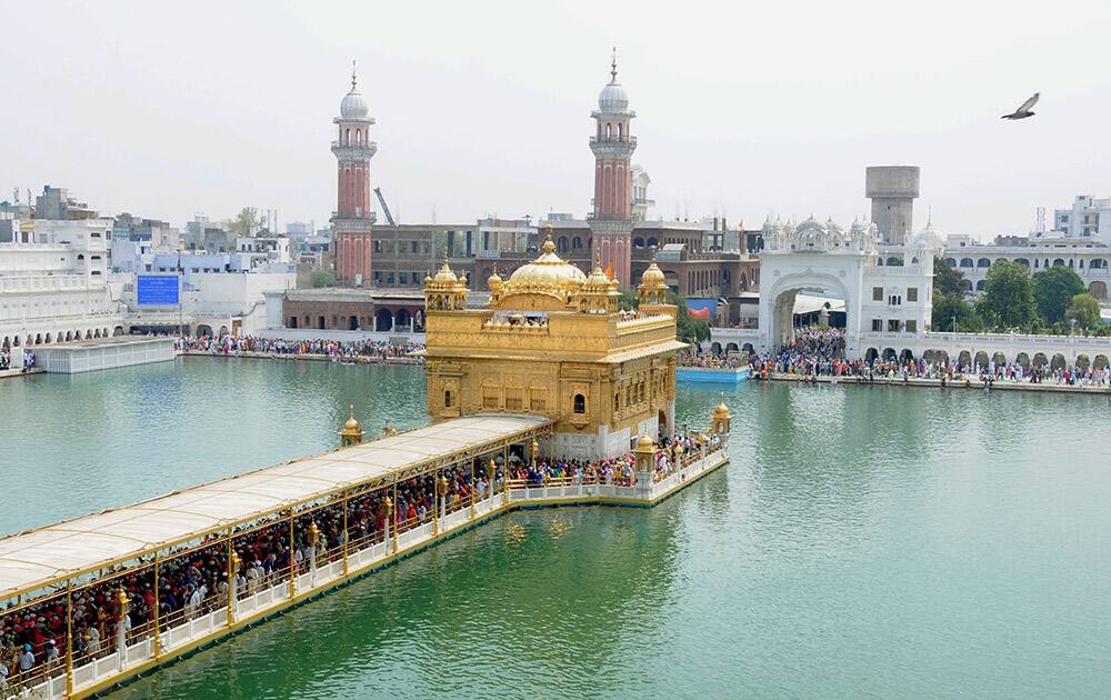 Devotees paying obeisance at Golden Temple on the occasion of Baisakhi festival at Amritsar.