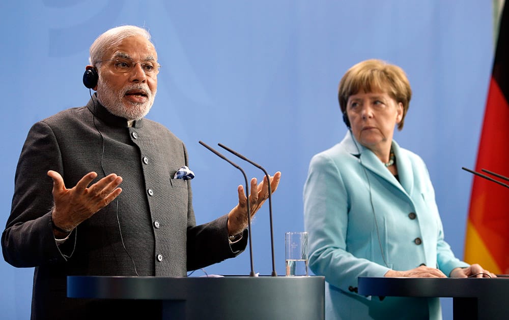 German Chancellor Angela Merkel and the Prime Minister of India Narendra Modi address the media during a joint press conference as part of a meeting at the Chancellery in Berlin, Germany.