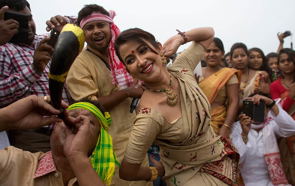 Assamese people perform Bihu dance during Rongali Bihu, a harvest festival, in Guwahati.