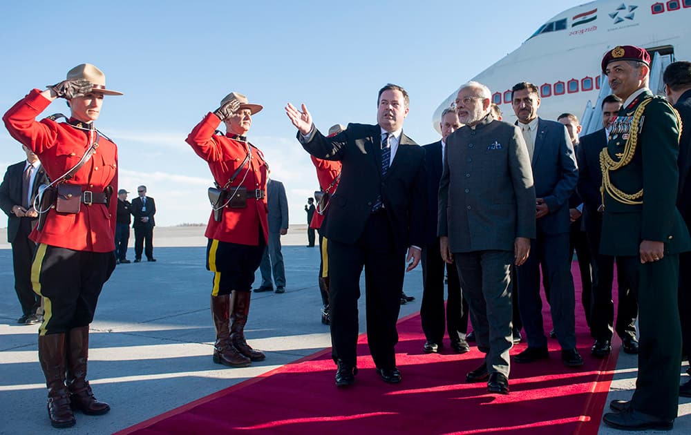 Minister of National Defense Jason Kenney walks with PM Narendra Modi as he arrives at arrives at Ottawa, Ontario, for a state visit.