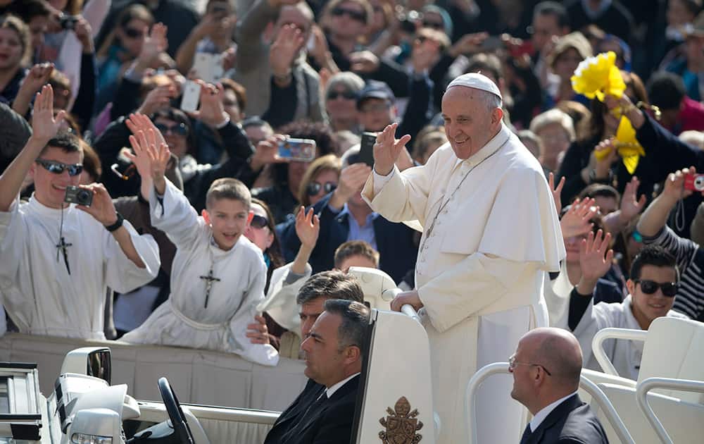 Pope Francis arrives for his weekly general audience, in St. Peter's Square, at the Vatican.
