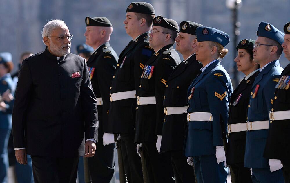 Prime Minister Narendra Modi inspects the honour guard on Parliament Hill in Ottawa.