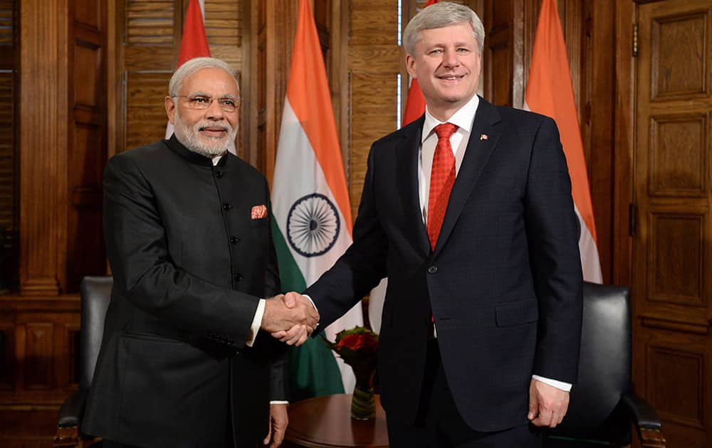 Prime Minister Narendra Modi takes part in a meeting with Prime Minister Stephen Harper in his office on Parliament Hill in Ottawa.